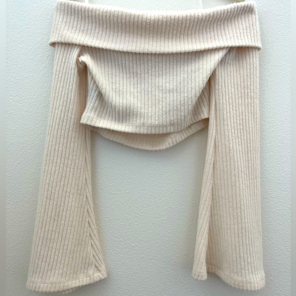 Cream off the shoulder cropped sweater.